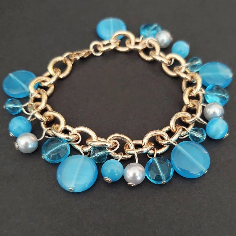 Blue bead and faux pearl charm style bracelet